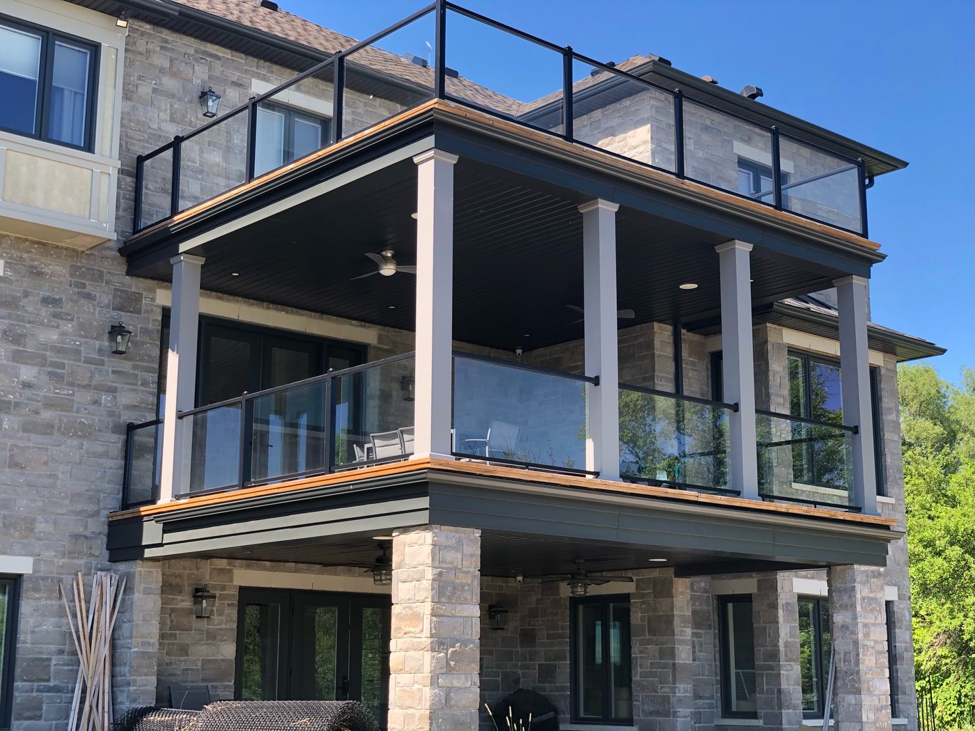 Two-storey deck with glass railings